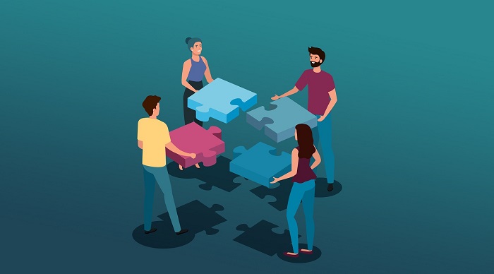 Employees actively engaging in connecting the puzzle together thus improving the employee engagement.